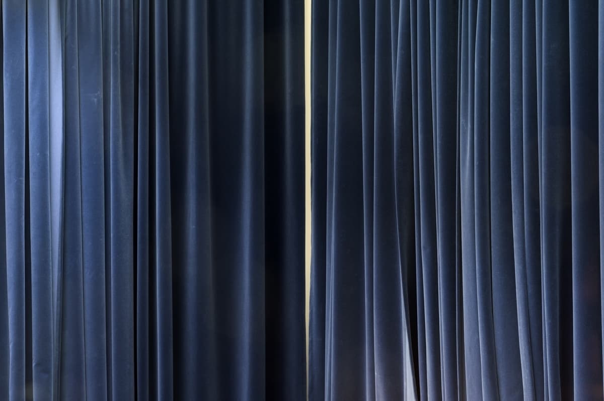 Curtains revealing a wall, interior view American Embassy Oslo